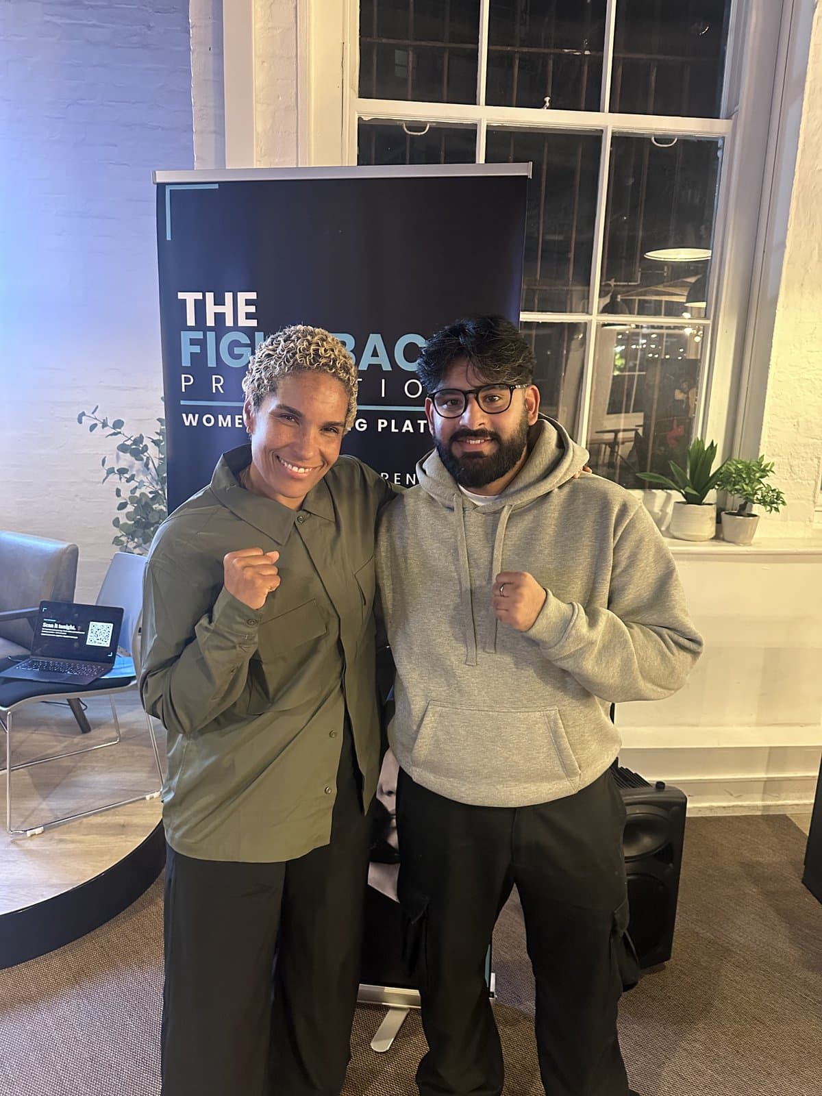 Lesley Sackey, co-founder of The Fight Back, with SHWDWN co-founder Joshua Chumber in front of The Fight Back banner at the launch event